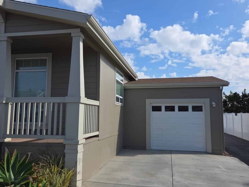 Beautifully renovated house exterior with fresh paint and modern design.