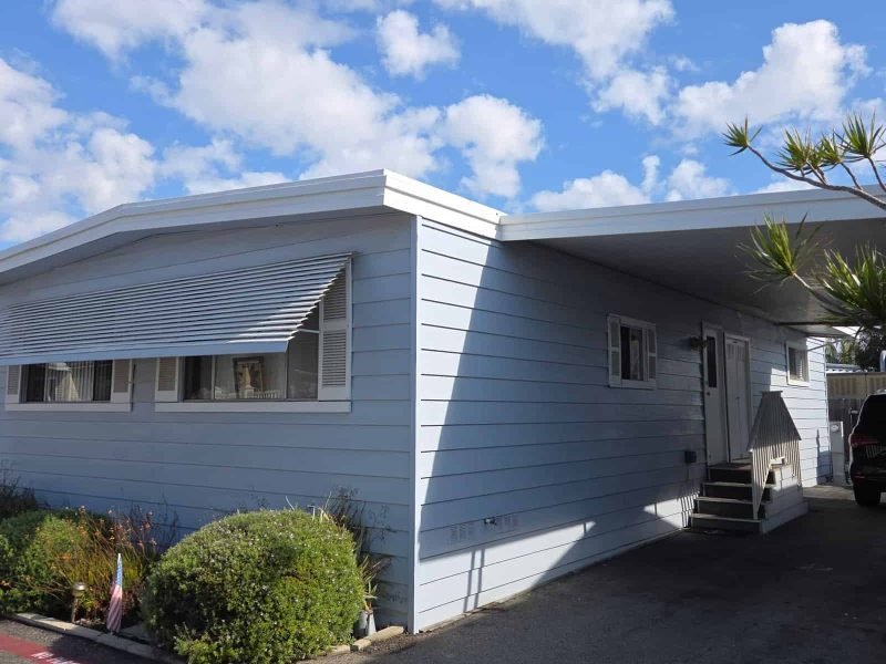 Modern white house with siding, remodeling, and outdoor enhancements.